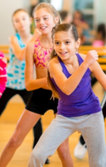 Group of children participating in dance fitness class.